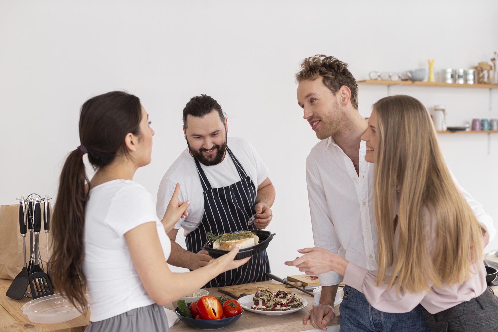 Chef teaching small group in workshop
